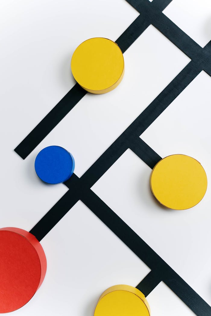 Geometric abstract art with vibrant circles and black lines on a white background, minimal and conceptual.